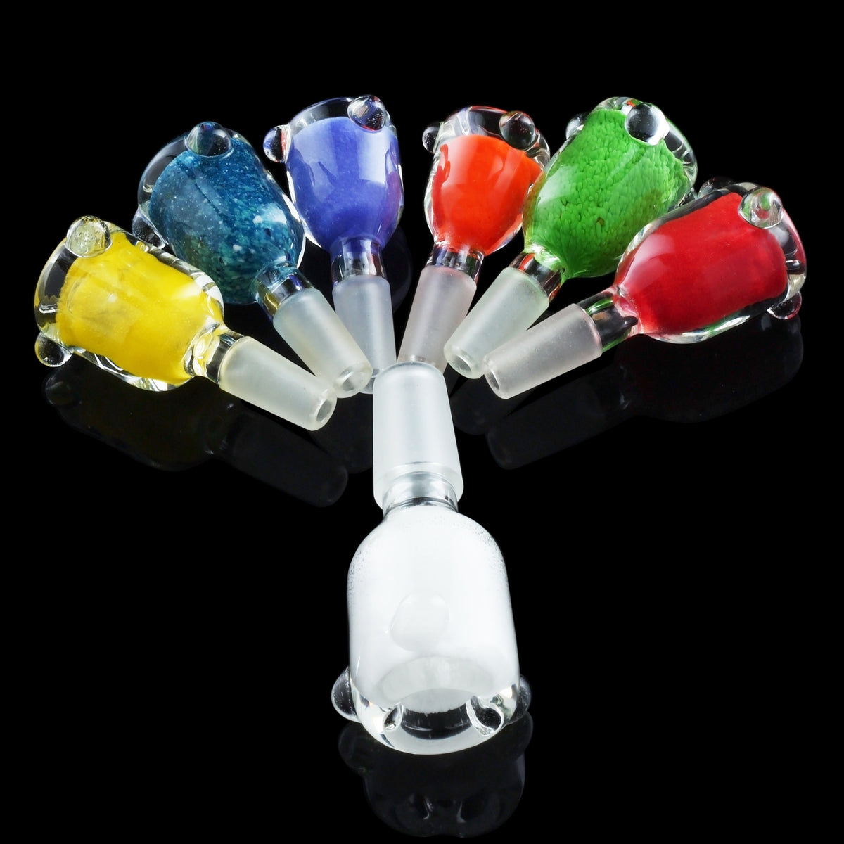 Colorful glass bowls for cannabis use displayed around a glass downstem, isolated on a black background.