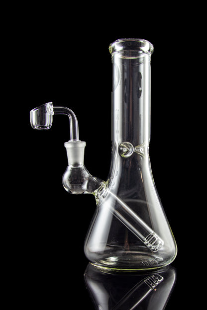 Clear glass bong with a quartz banger, isolated on black.