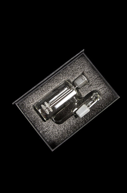 Clear glass dab rig displayed in a foam-lined case.