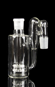 Clear glass bubbler water pipe with diffusion perc, reflecting on a black surface.