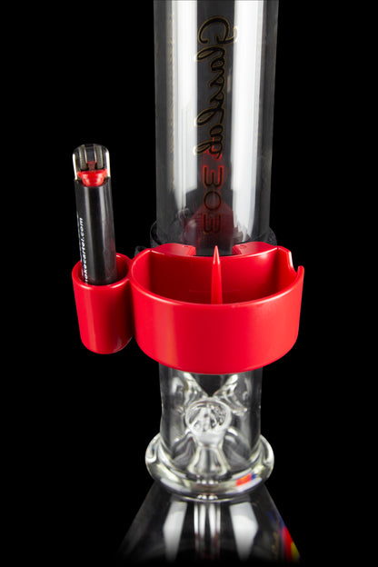 Red silicone attachment for a glass water pipe with a cannabis concentrate dab rig insert.
