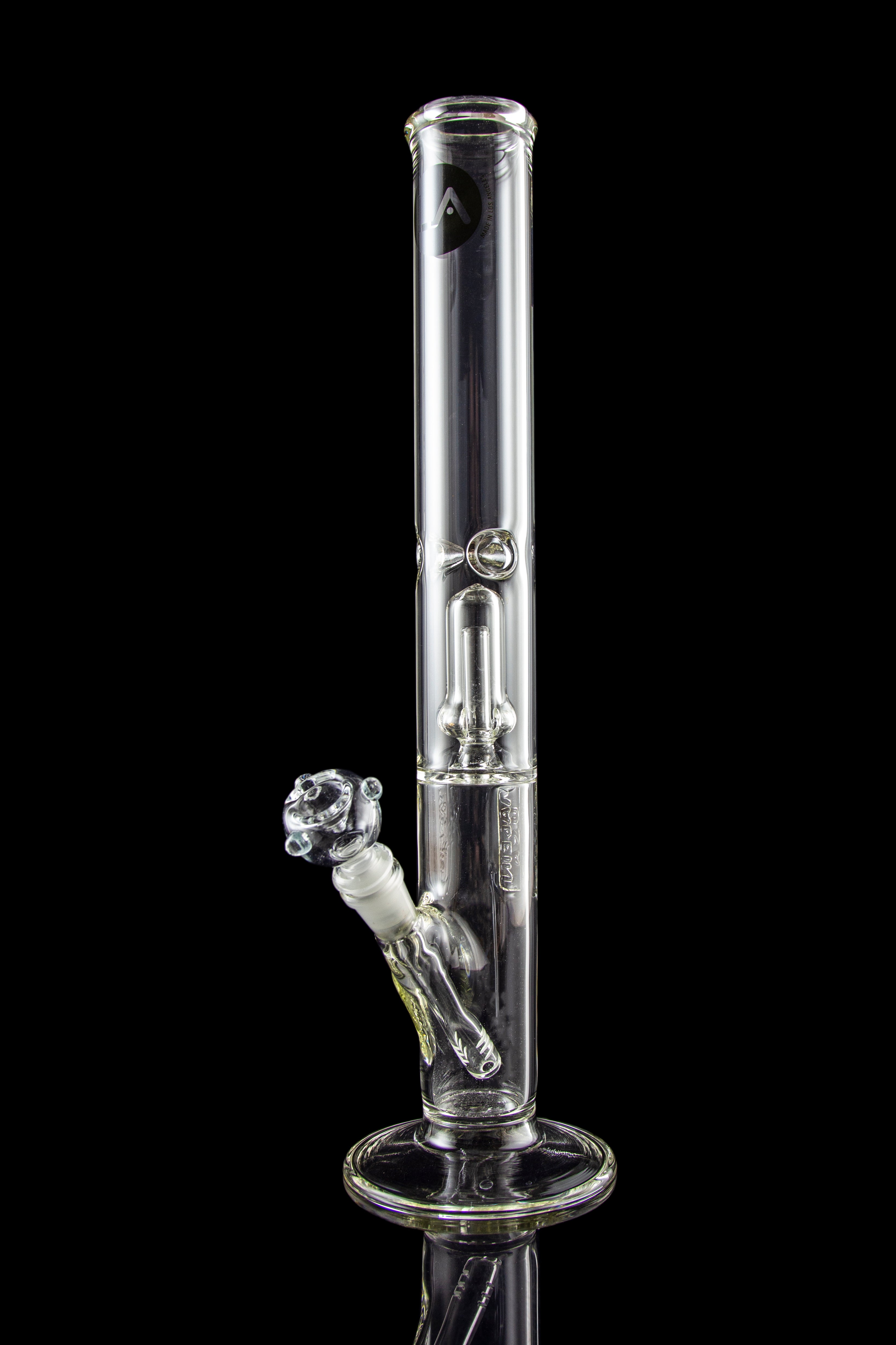 Clear glass bong with ice catch and intricate percolators, isolated on a black background.