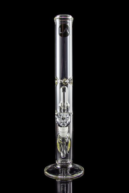 Clear glass bong with intricate percolators, isolated on a black background.