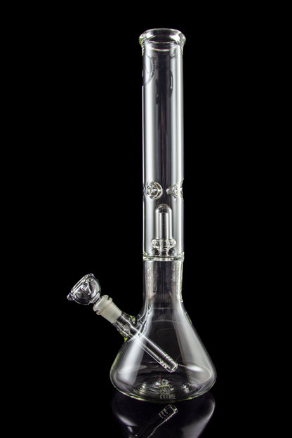 Clear glass bong with intricate percolator, isolated on black.