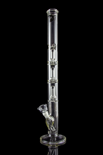 A tall, clear glass bong with multiple chambers and a glass bowl, isolated on a black background.