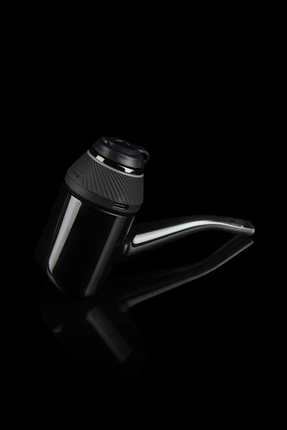 Sleek, black cannabis water pipe with a transparent glass chamber and angled mouthpiece, isolated on a dark background.