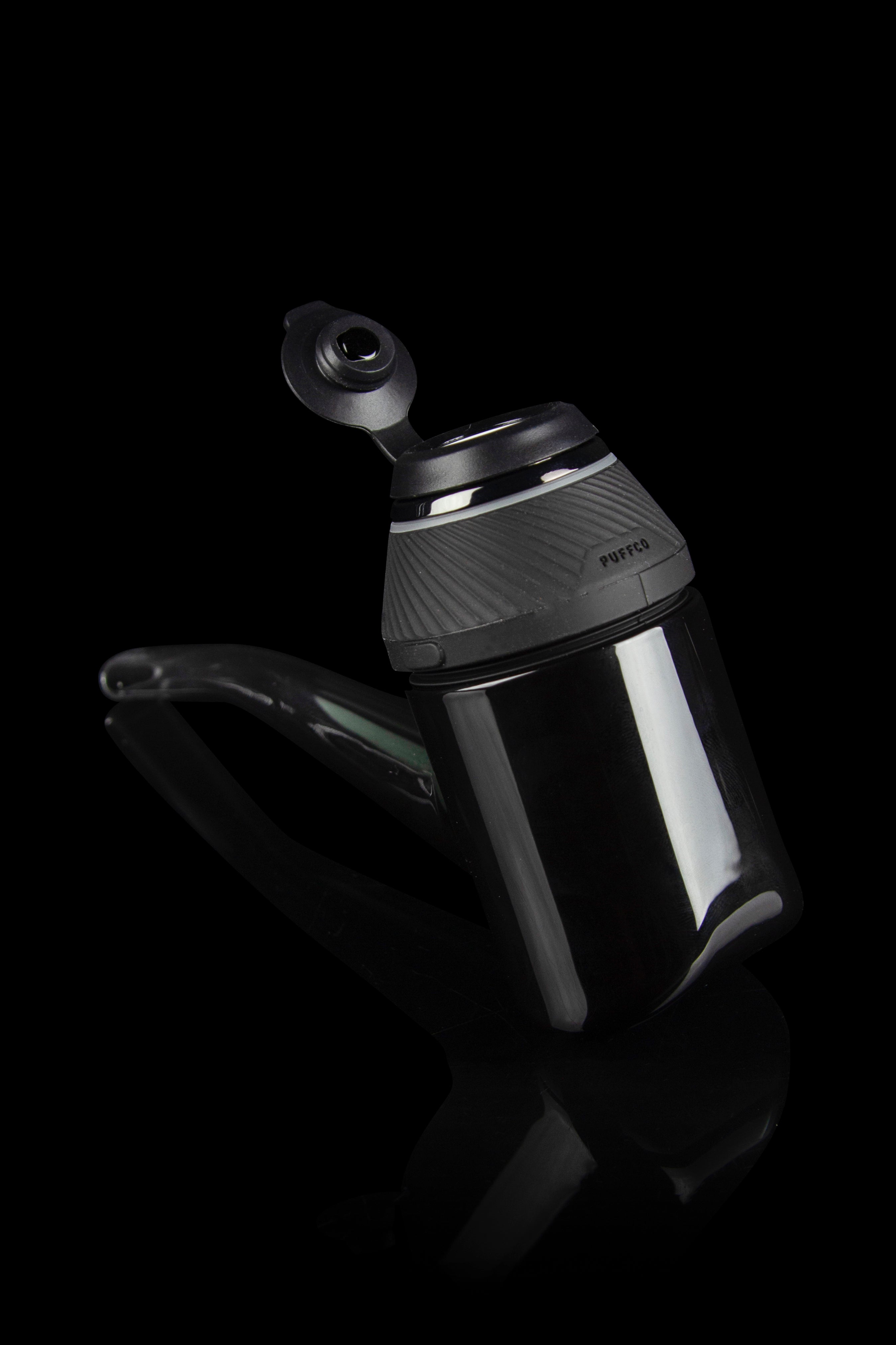 Black Puffco Peak Pro portable vaporizer with glass attachment.