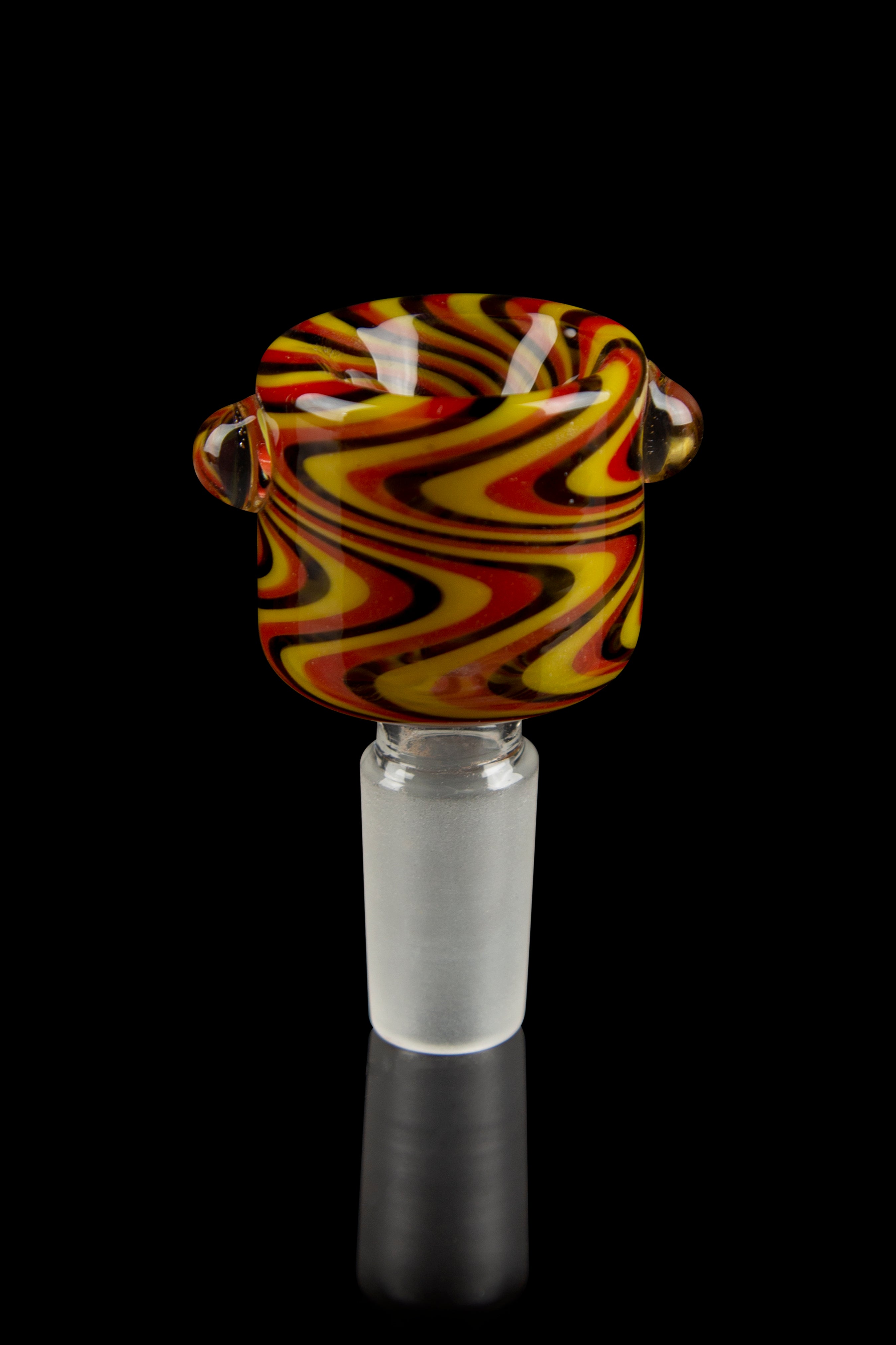 Close-up front view of the Honeybee Herb Wig Wag Flower Bowl showing swirling red, yellow, and black wig-wag patterns against a black background