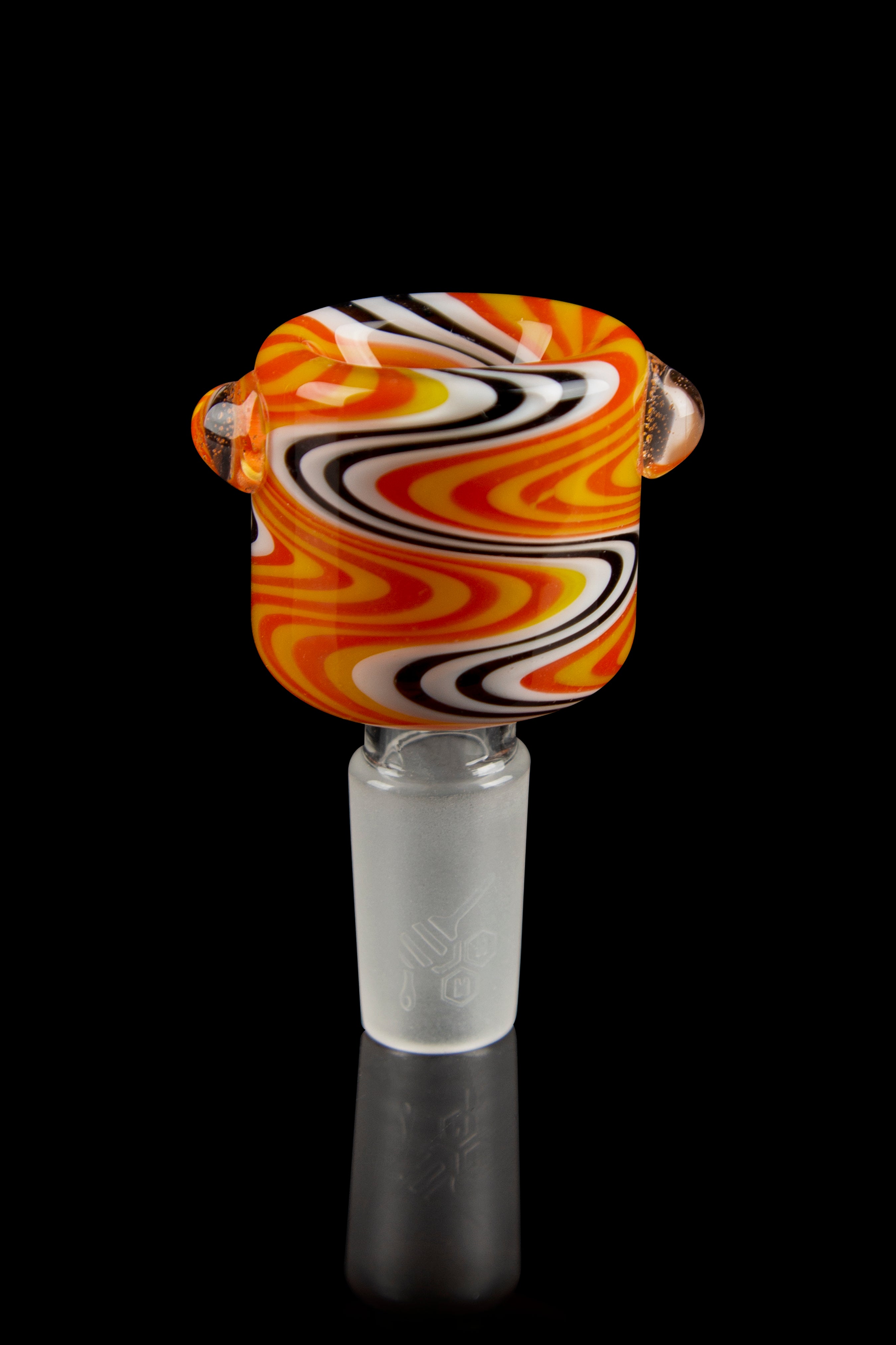 Close-up front view of the Honeybee Herb Wig Wag Flower Bowl showing swirling orange, yellow, white, and black wig-wag patterns on glass.