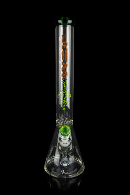 Glass bong with intricate orange and green designs, studio shot on black background.