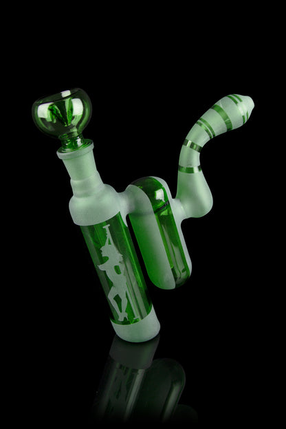 Green glass bubbler water pipe with etched design, studio shot.