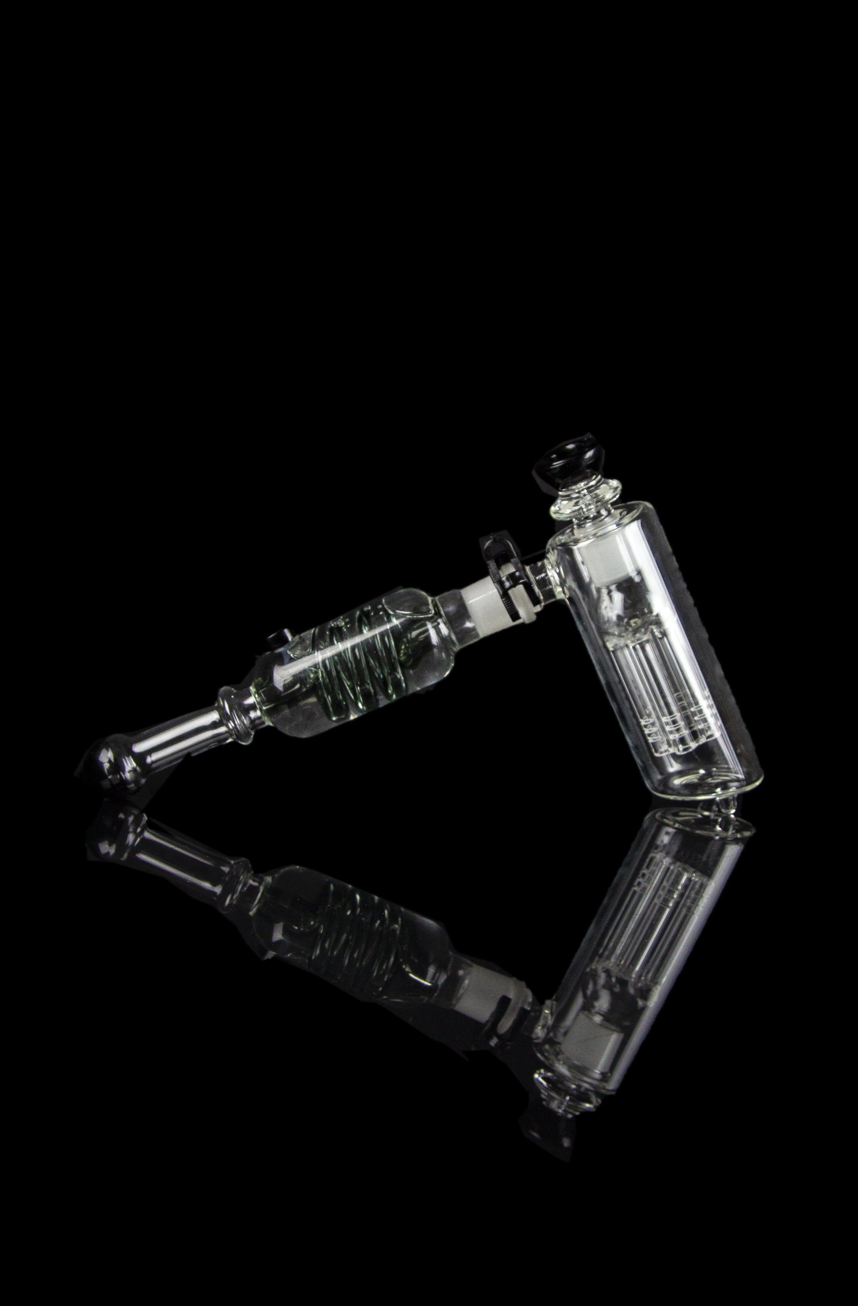 Clear glass rig with percolators against a black background.