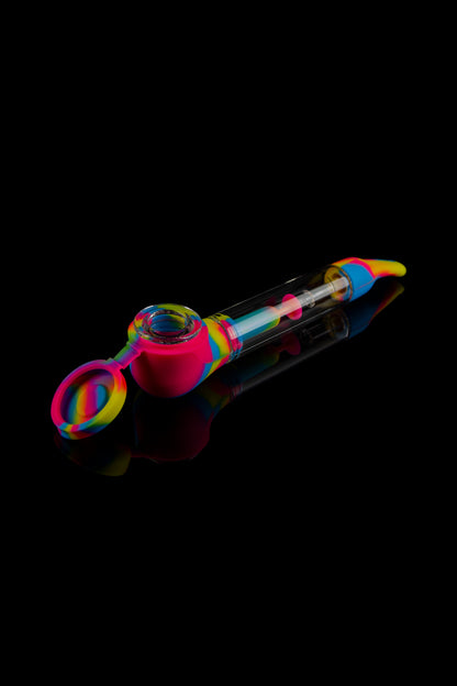 Colorful silicone glass pipe with a clear chamber, isolated on a black background.