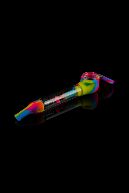 Colorful silicone oil rig with glass bowl, isolated on black.