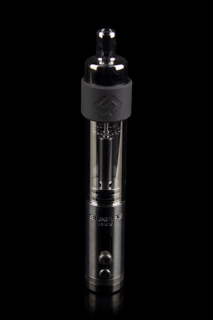 Black cannabis e-rig with visible glass chamber and heating coil.