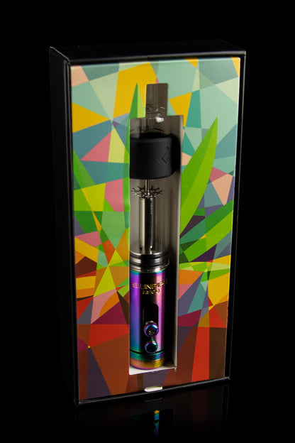 Black and iridescent cannabis vaporizer pen displayed in a colorful, geometric patterned box.