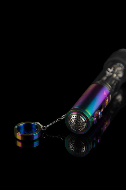 Iridescent glass pipe with a metal bowl and chain, isolated on a black background.
