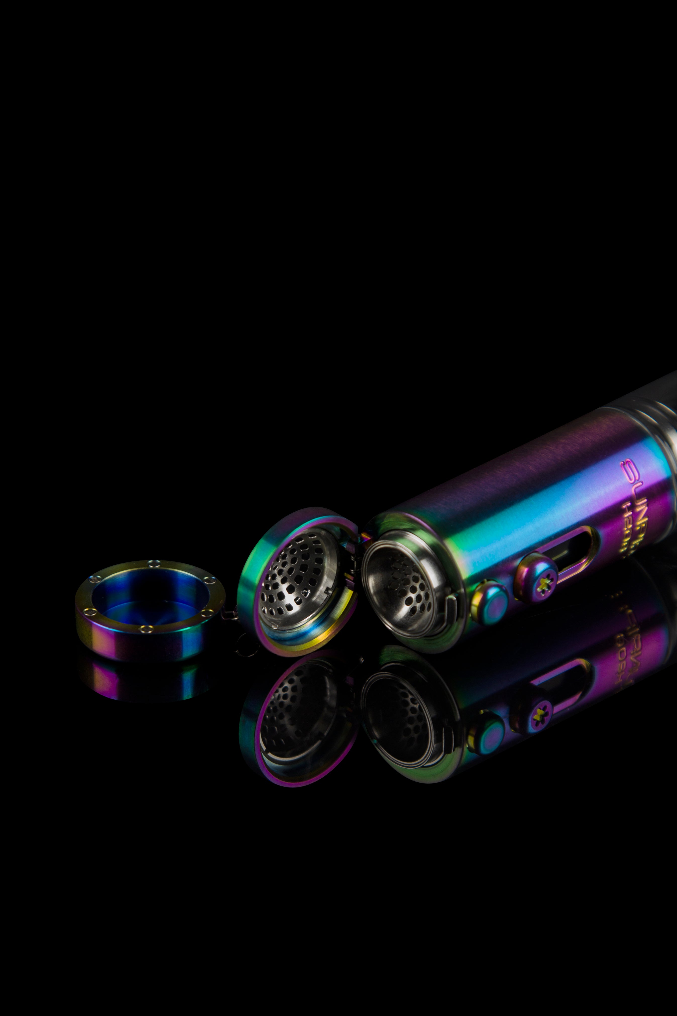 Disassembled iridescent cannabis pipe with multiple mesh screens and components floating against a black background.