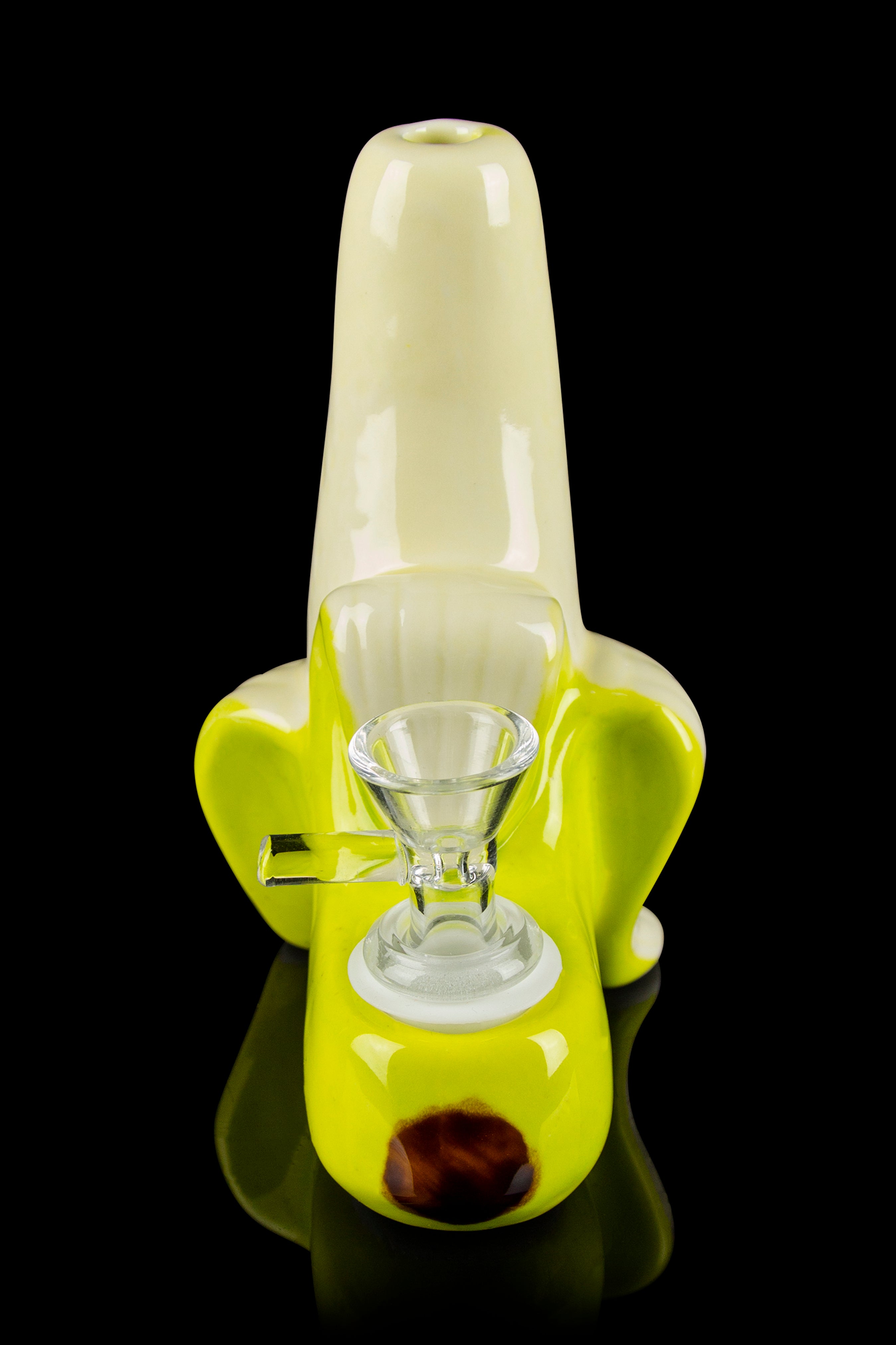 Yellow glass bubbler water pipe with a glass bowl, studio shot on black.