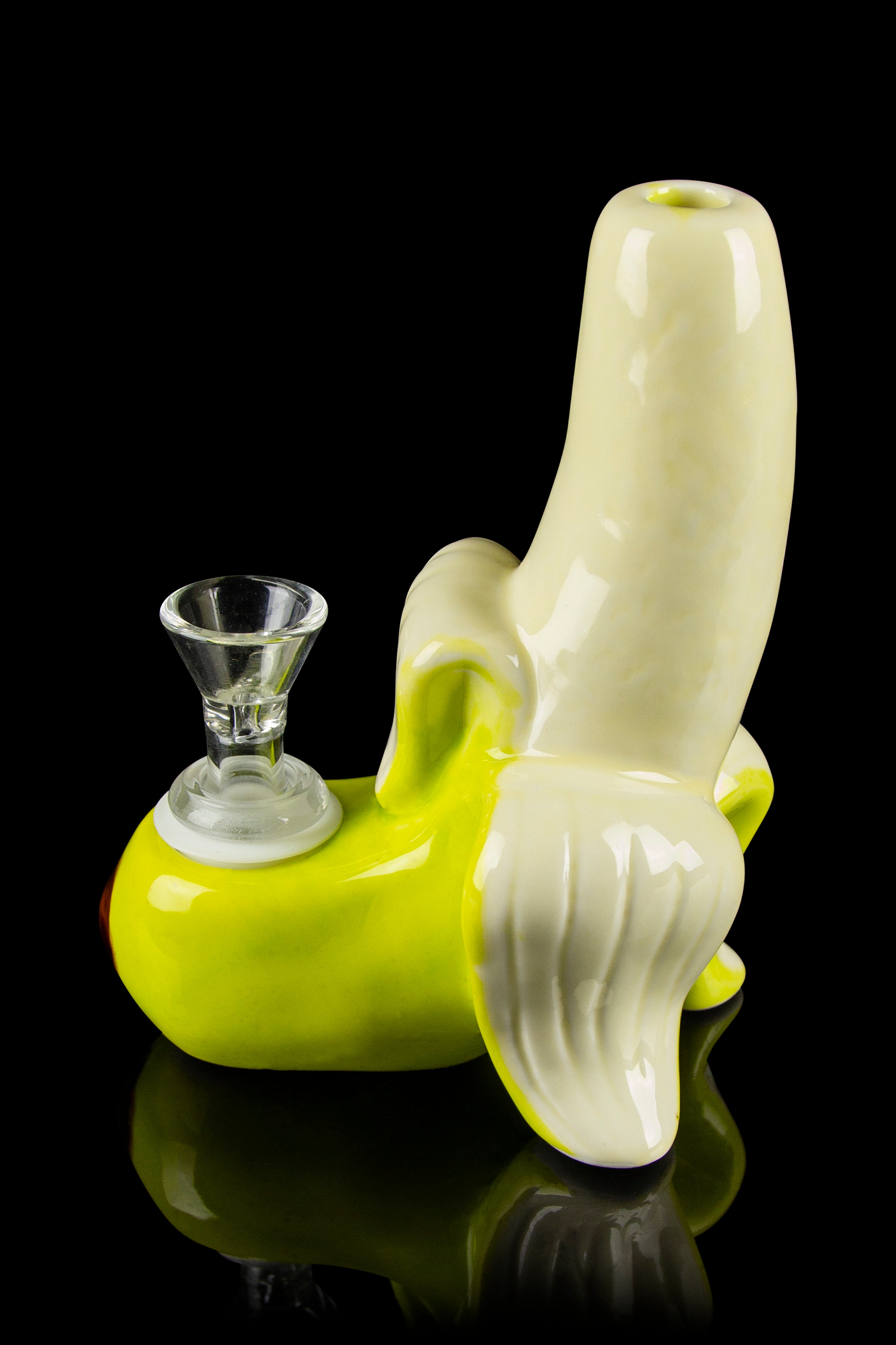 A vibrant green glass water pipe shaped like a banana with a clear glass bowl.