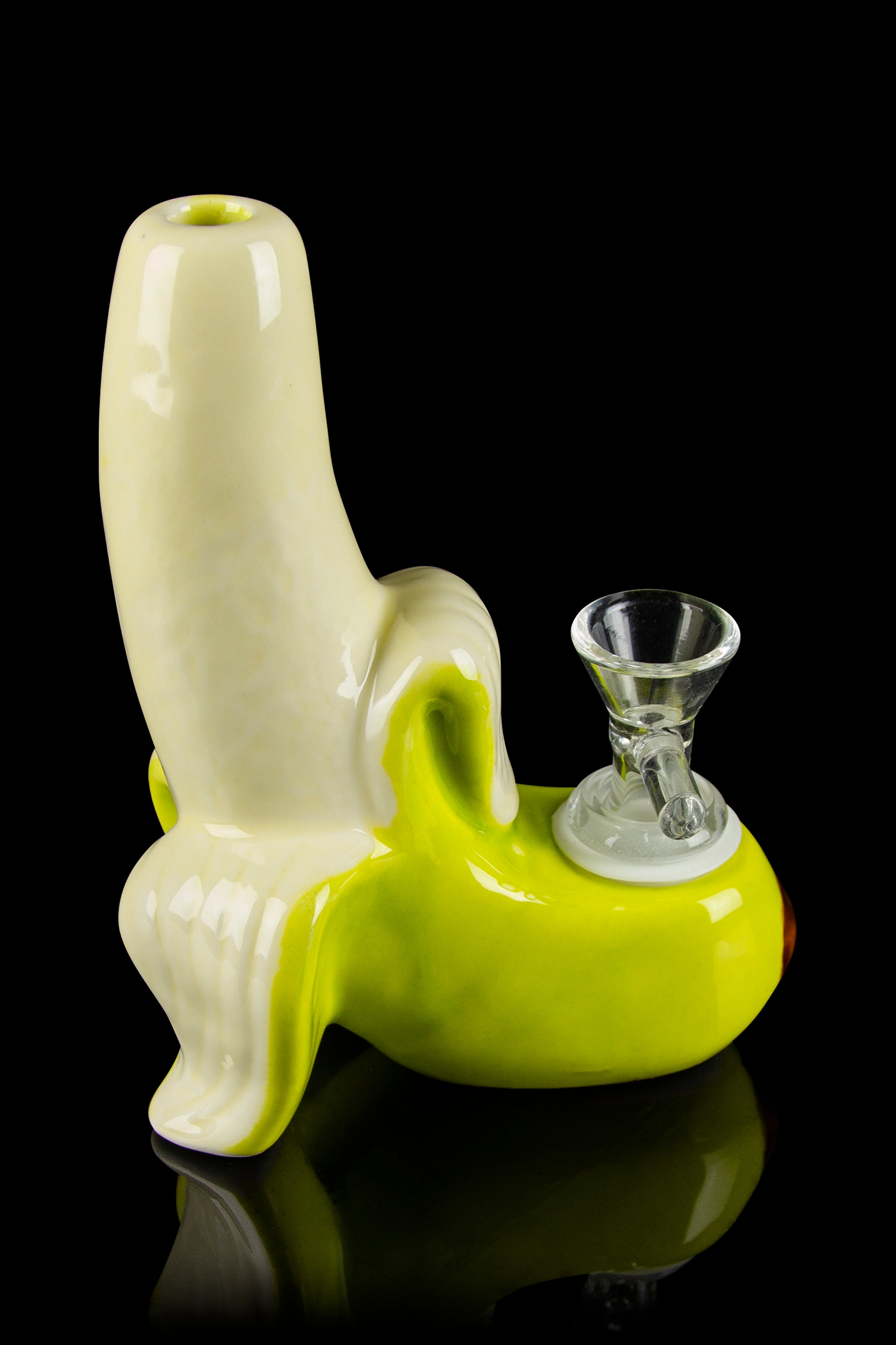 A pale yellow glass bubbler shaped like a banana with a clear glass bowl piece inserted.