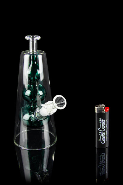 Emerald green glass water pipe with smoke swirling inside, displayed with a lighter.