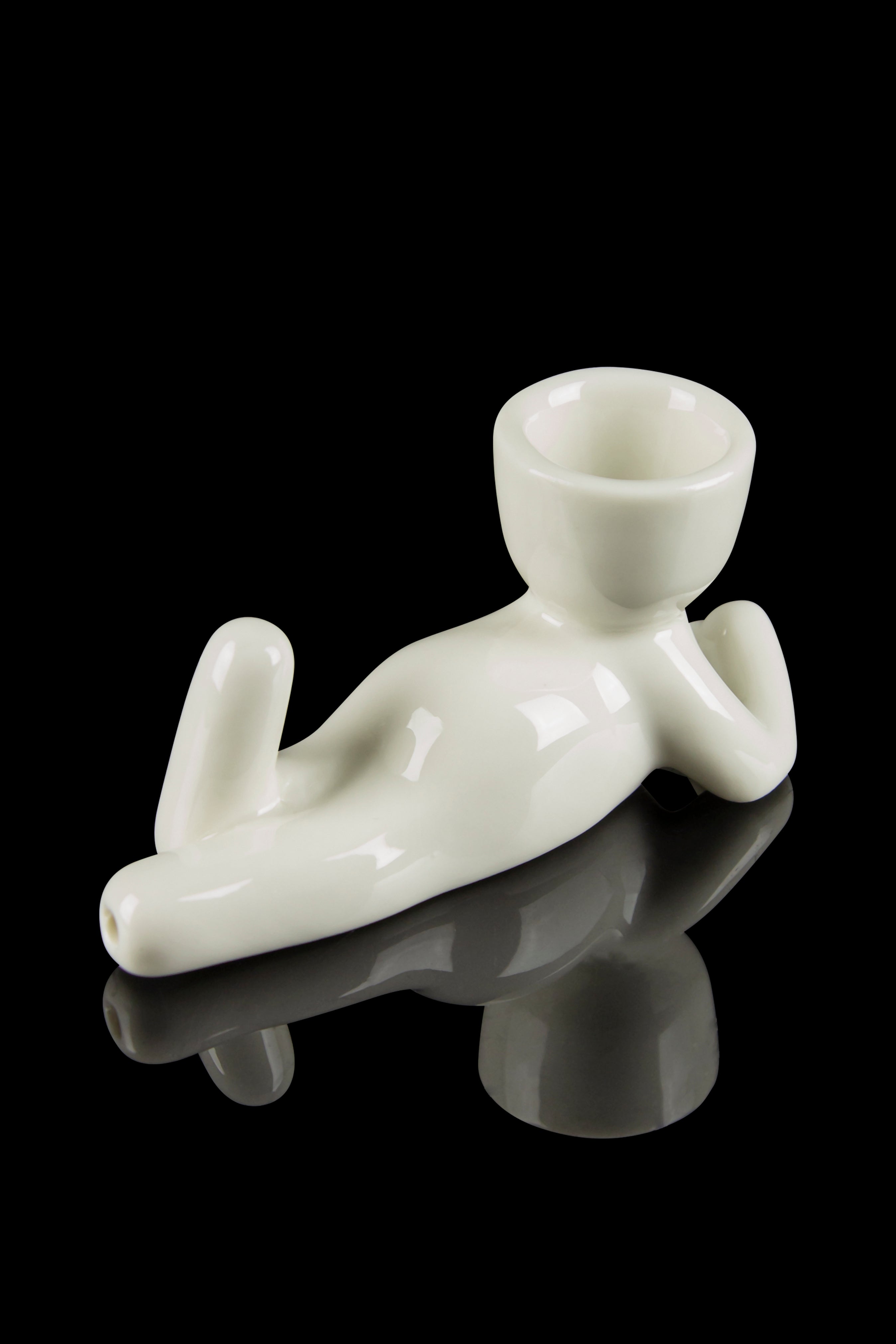 Frosted glass cannabis oil rig with a unique reclining figure design.