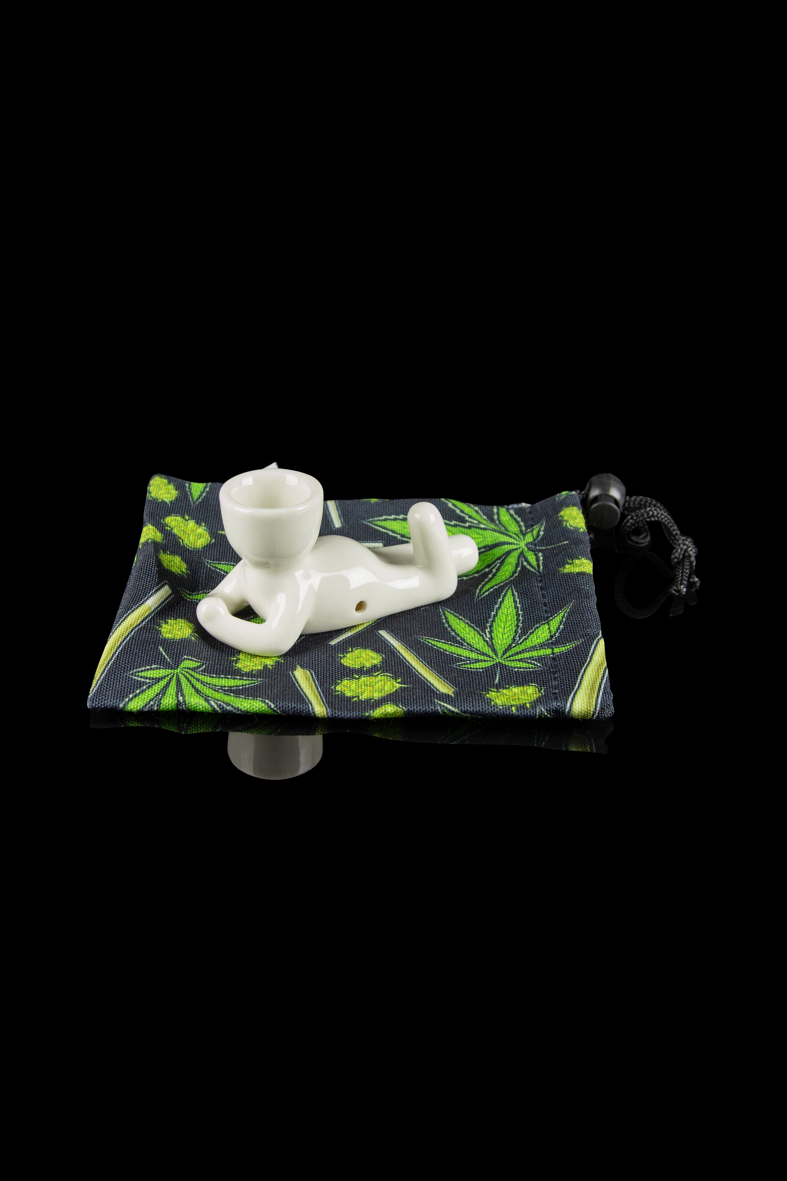 White glass pipe inside a cannabis leaf-patterned pouch.