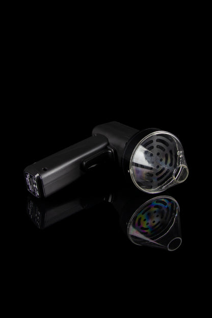 Black cannabis vaporizer with disassembled mouthpiece components against a dark background.