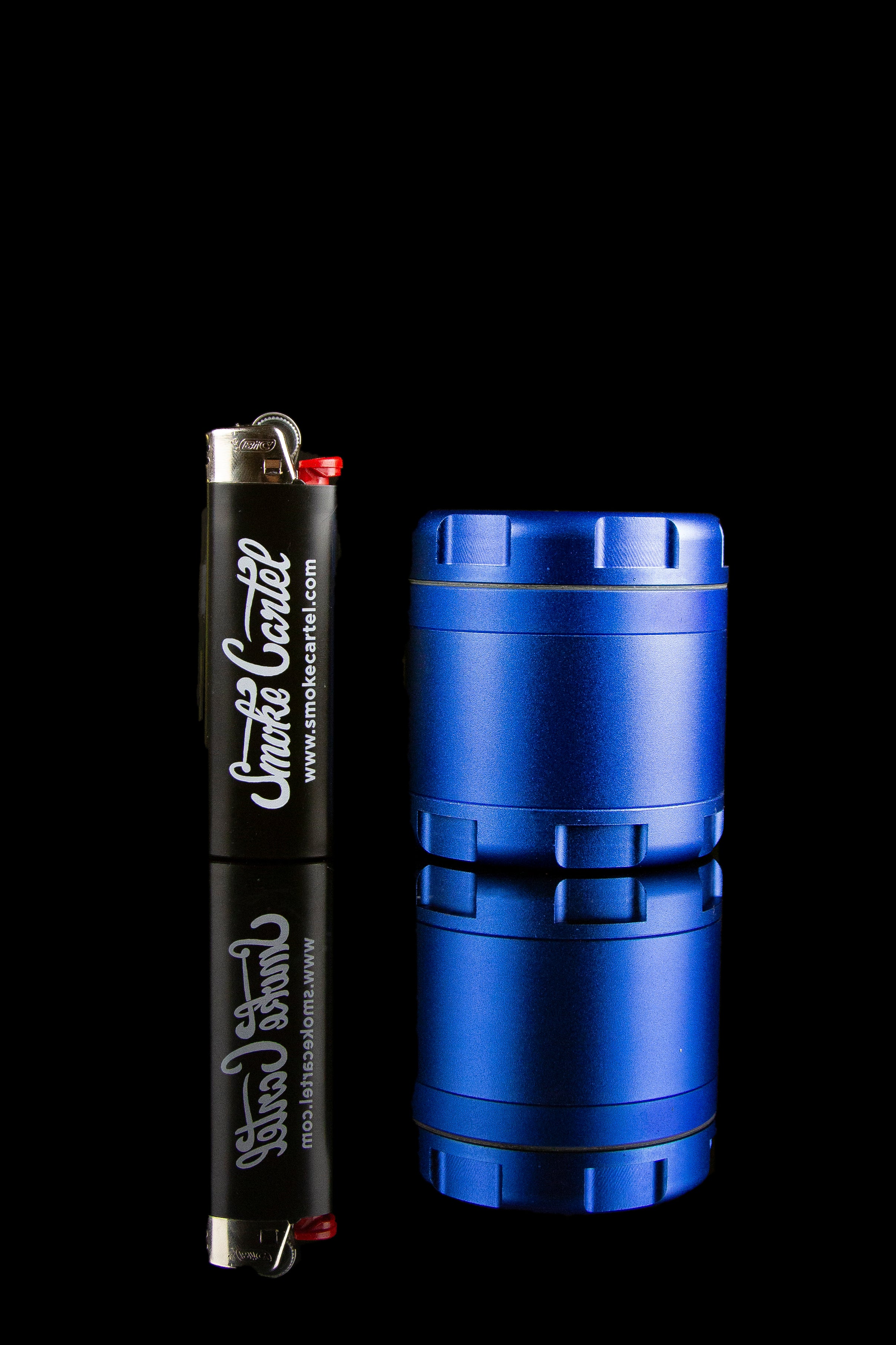 Blue electric dab rig and lighter with “Smoke Cartel” branding, studio shot.