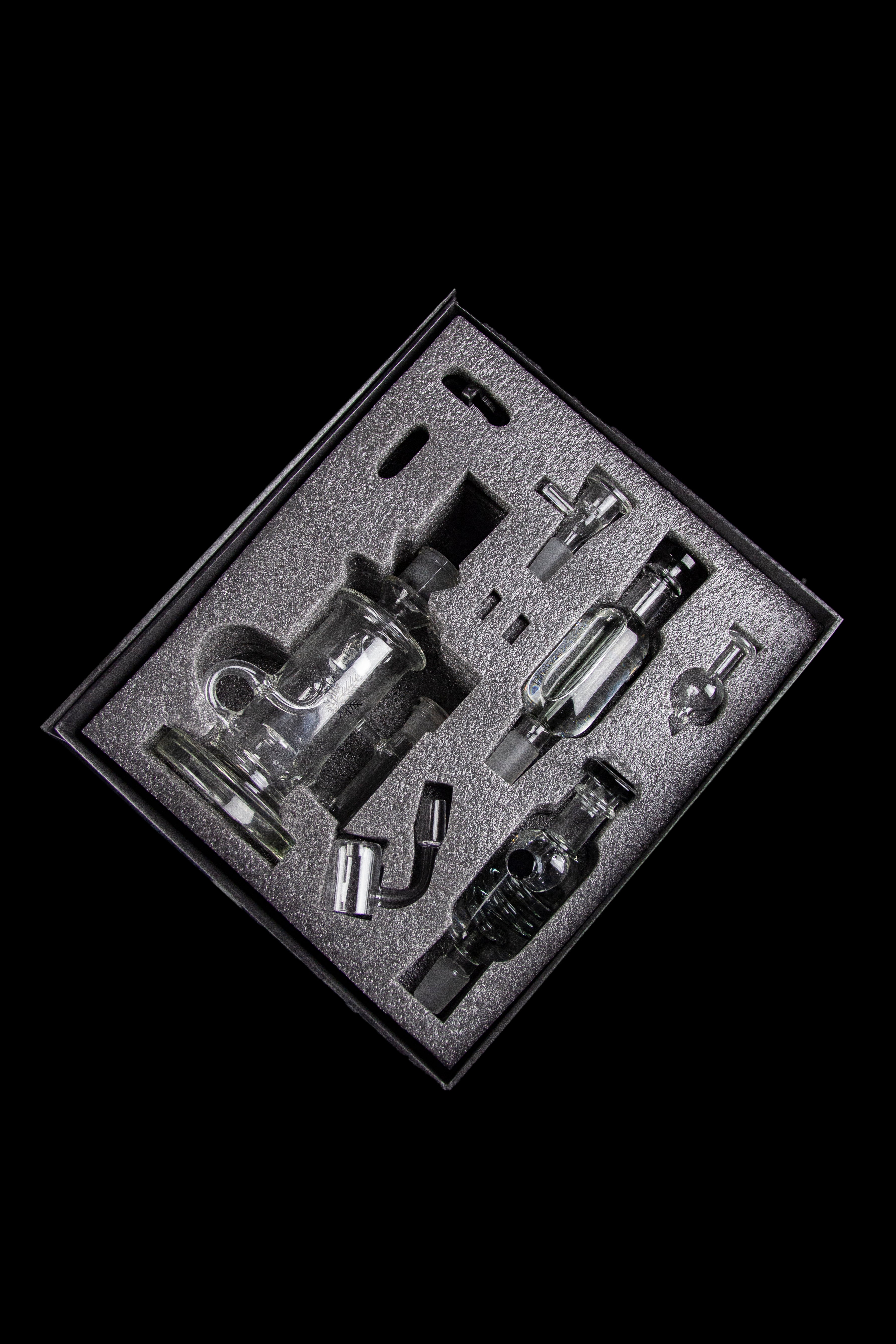 Cannabis dab rig set displayed in a foam-lined case.