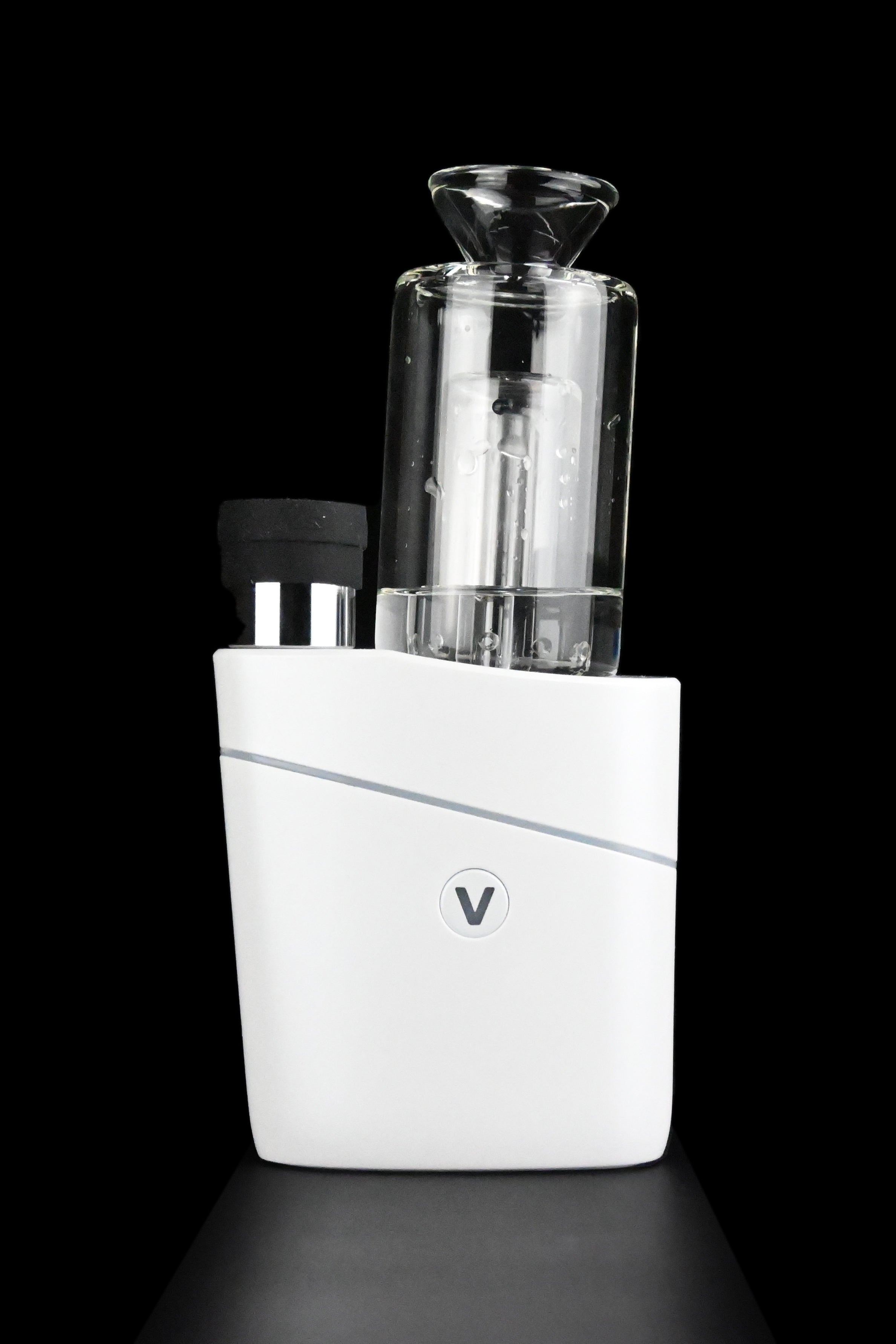 White cannabis e-rig with glass bubbler attachment, studio shot.
