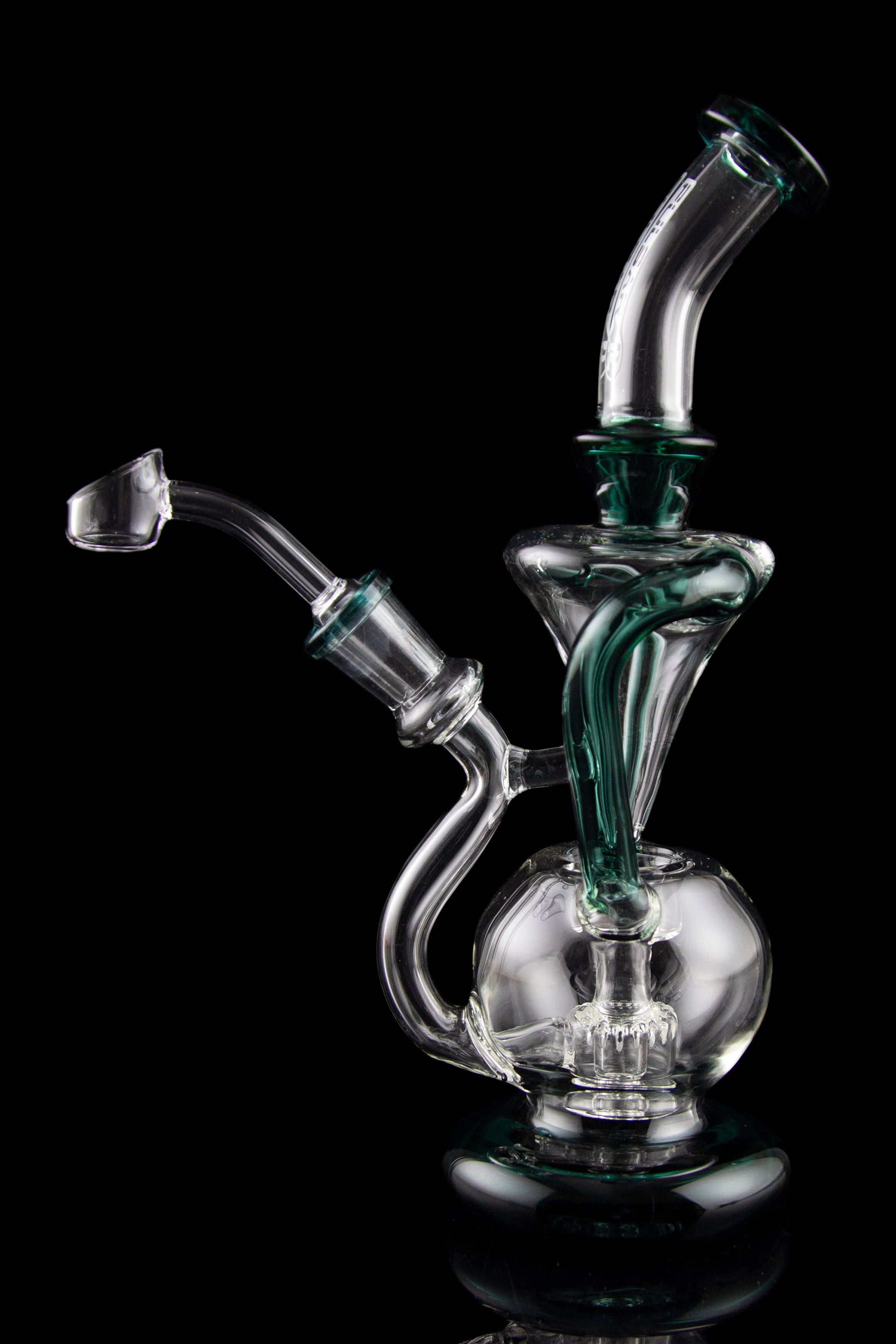 Clear glass water pipe (rig) with green accents, studio shot on black reflective surface.