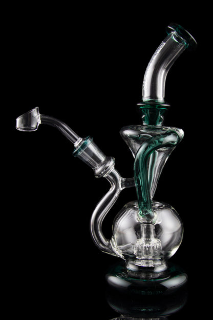 Clear glass water pipe (rig) with green accents, studio shot on black reflective surface.
