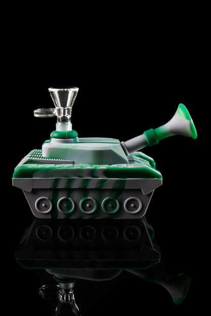 A green glass water pipe shaped like a tank, with a clear glass bowl and mouthpiece, set against a black background.