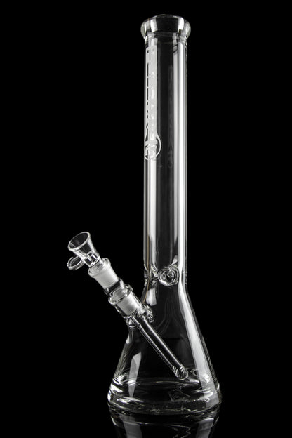 Clear glass bong with intricate design, isolated on black.