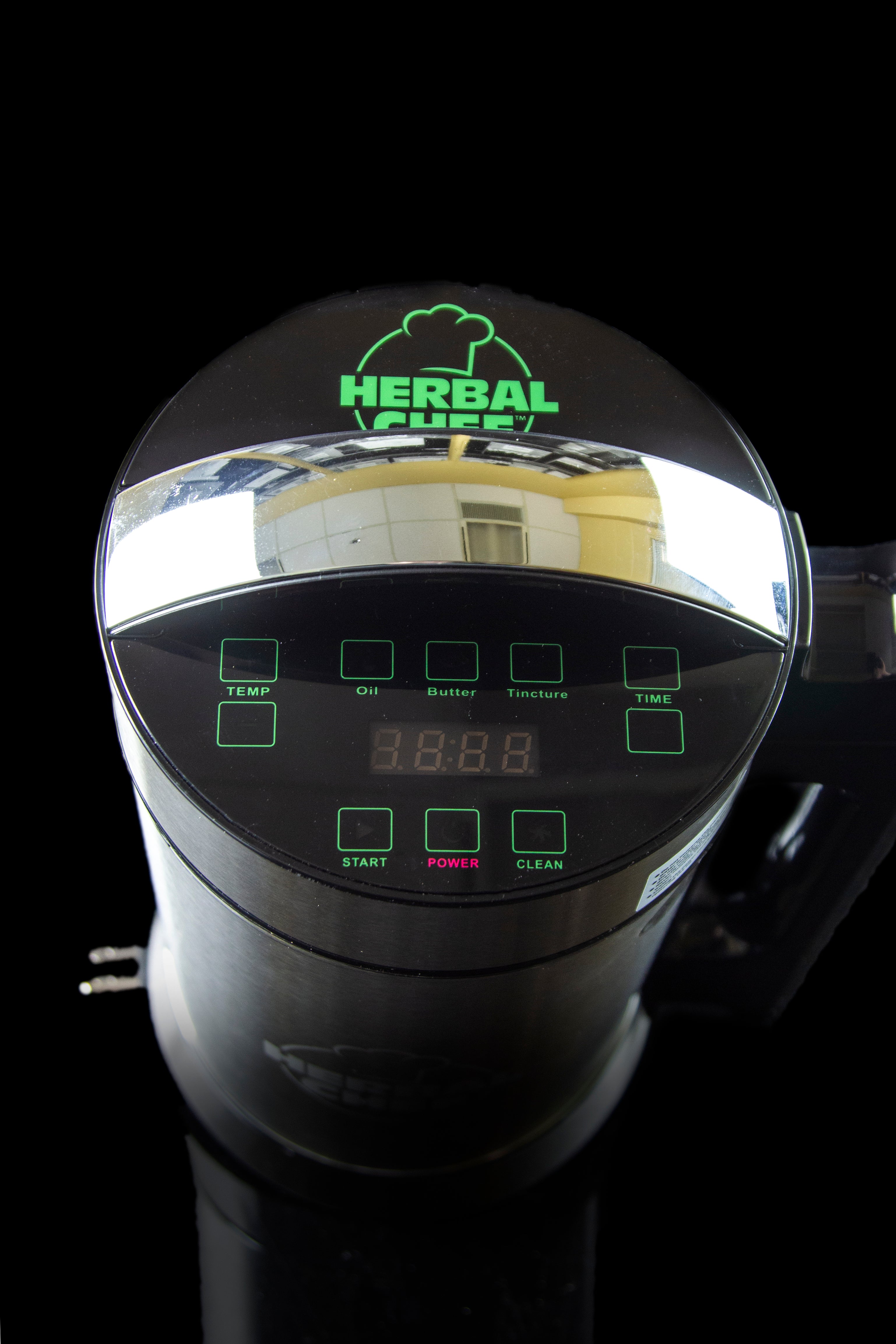 Close-up of a Herbal Chef infusion appliance control panel displaying digital timer settings.