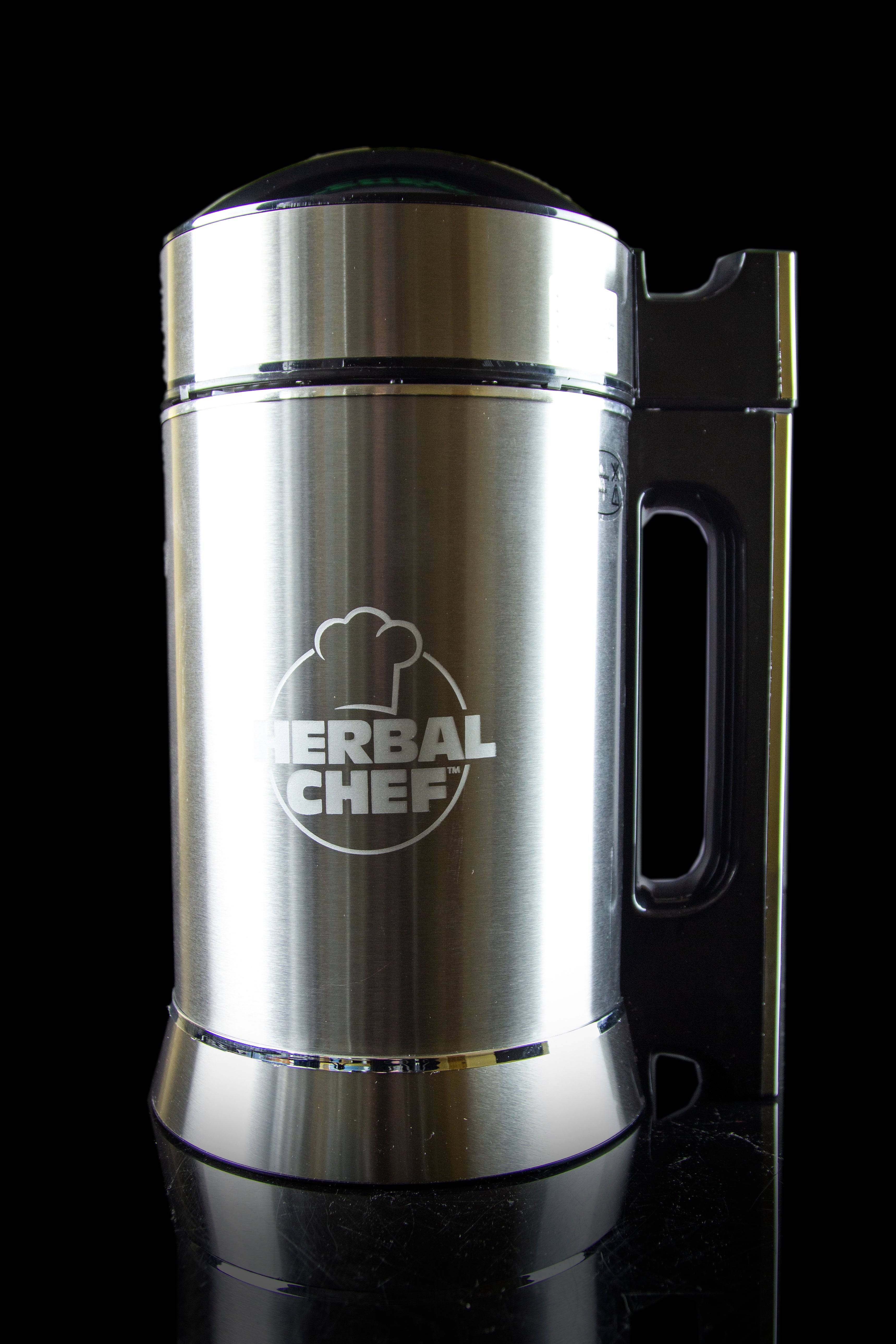 Stainless steel infusion appliance with “Herbal Chef” logo against a black background.