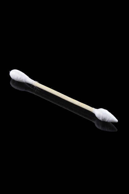 Diagonal close-up of a single wooden cotton swab with white tips against a black background, Crud Bud Cotton Swabs Tips 5.00% Off Auto renew