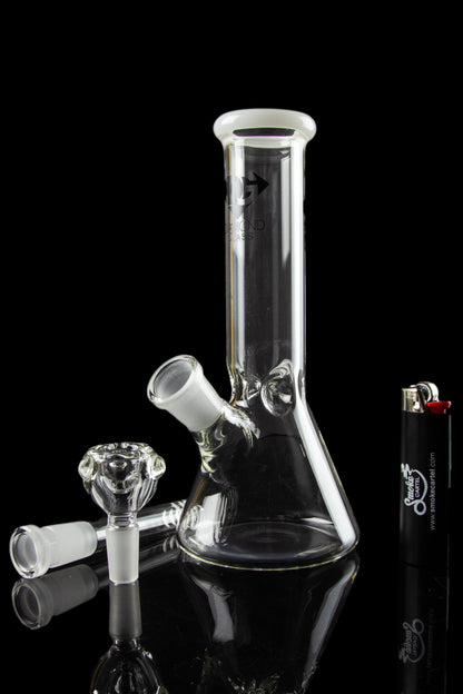 Glass bong with detachable downstem and bowl, alongside a lighter, on a reflective surface.