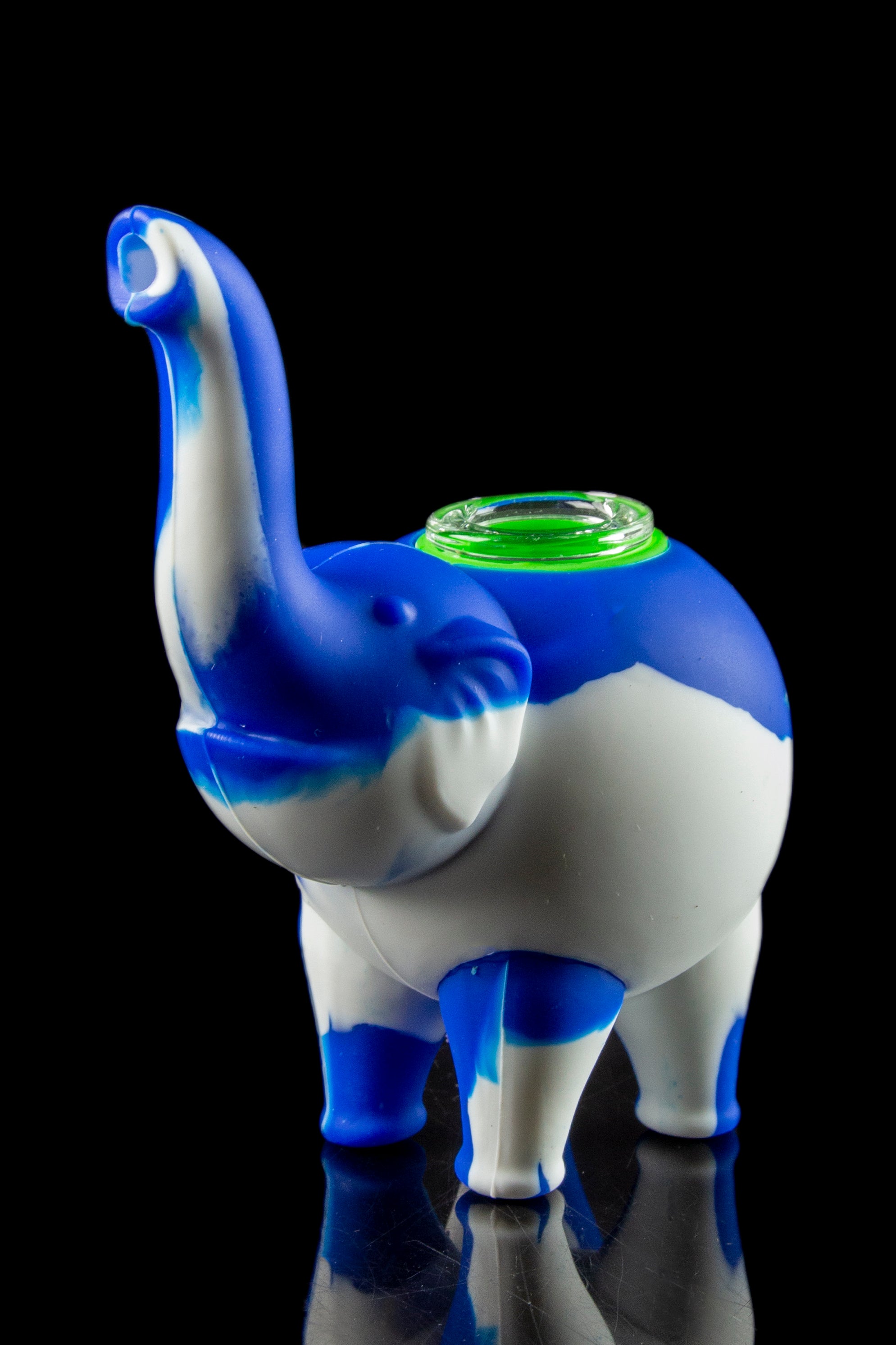 Front view of the Silicone Elephant Bubbler Pipe - Ellie, a pale blue, sculpted elephant form reflecting on a glossy black surface.