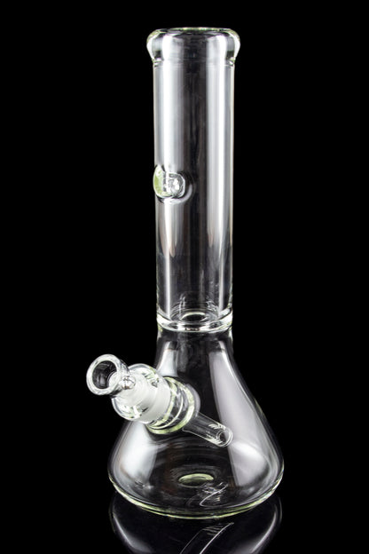 Clear glass bong with a flared base and ice catcher, isolated on black.