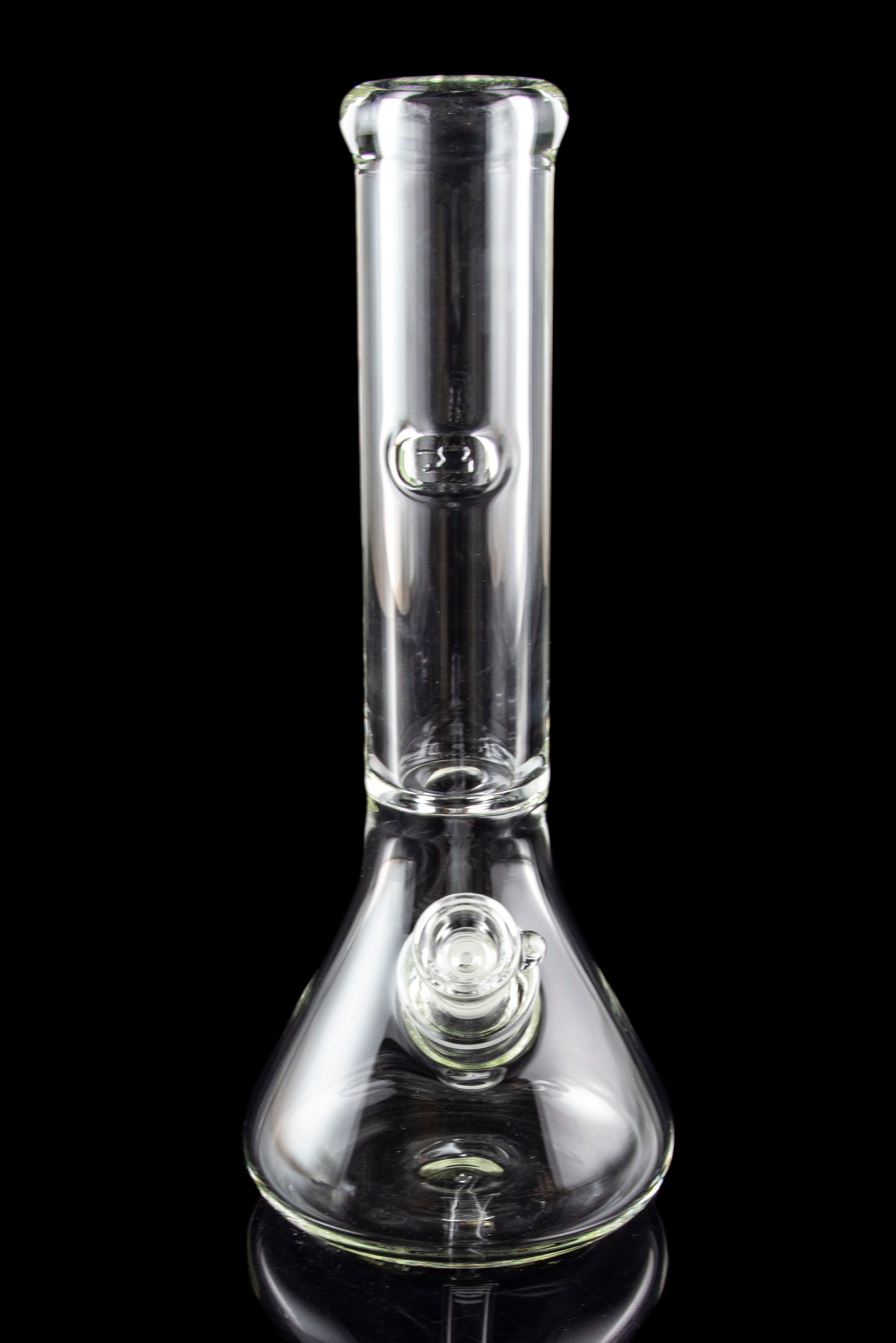 Clear glass water pipe (bong) with a flared base, reflecting on a dark surface.
