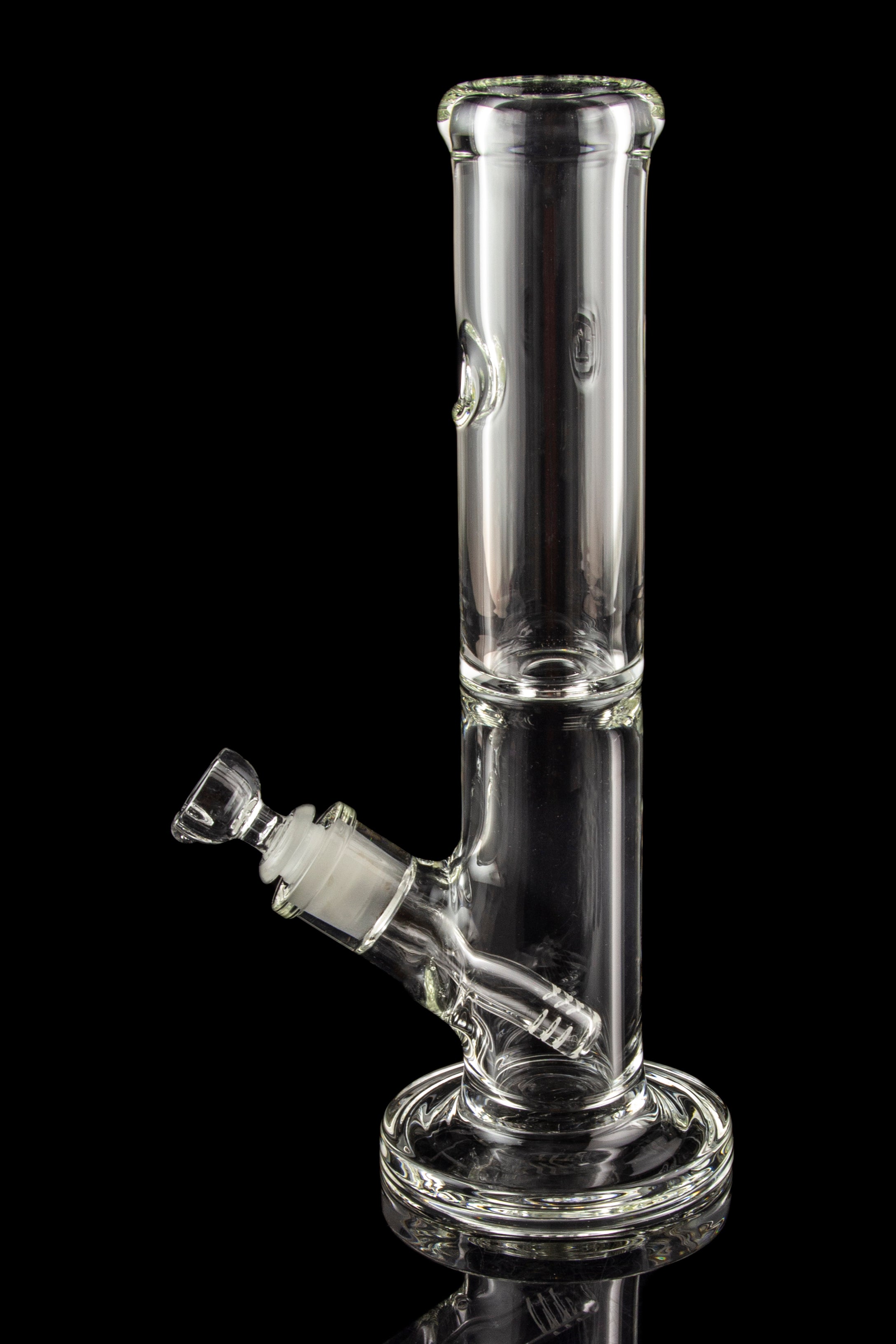 Clear glass water pipe (bong) with ice catcher and angled downstem against a black background.