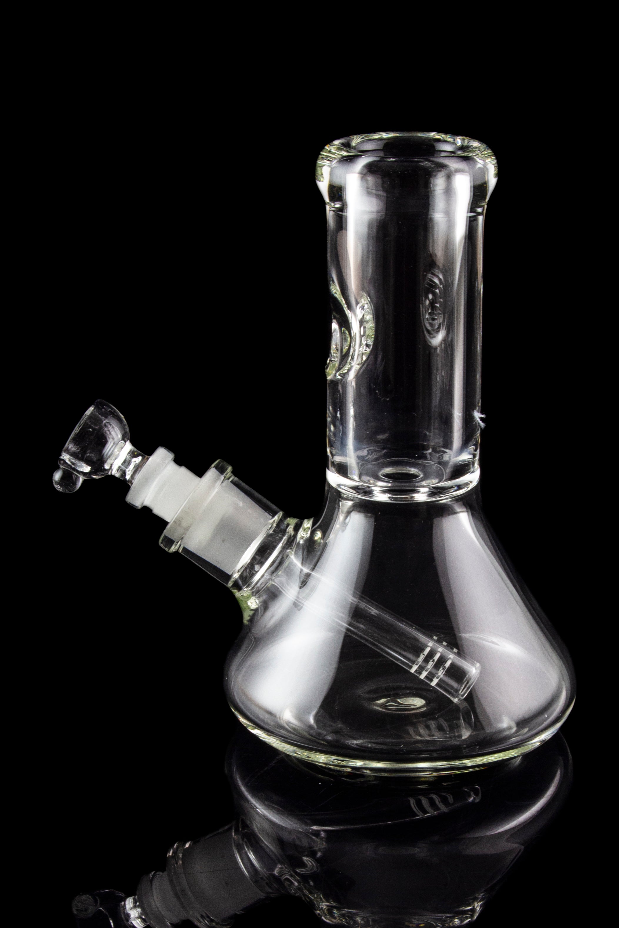 Clear glass water pipe (bong) against a black background.