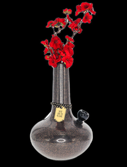 A patterned glass bong with artificial red flowers arranged in its neck, labeled "My Bud Vase."