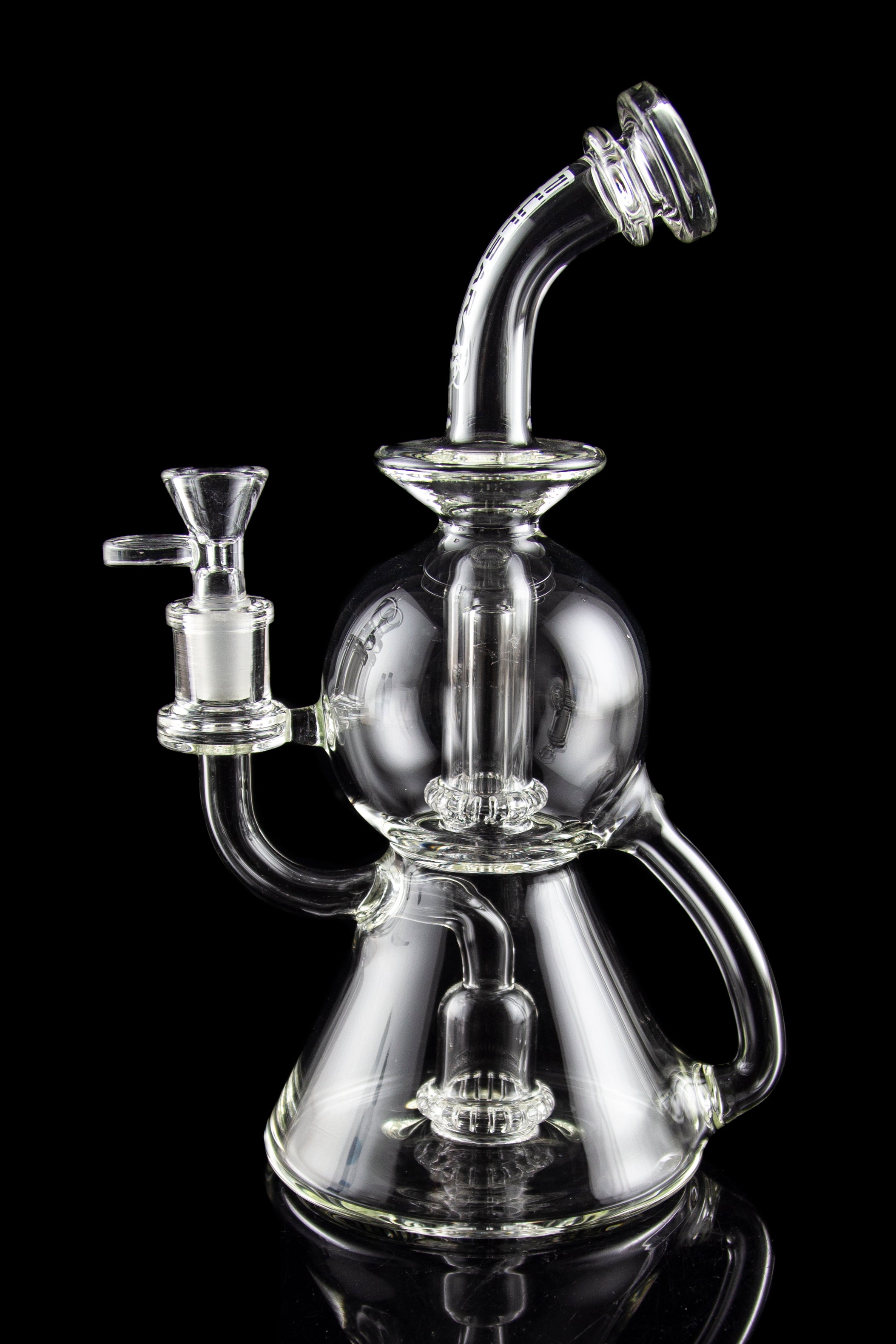 Clear glass water pipe (rig) with intricate bubbler design, isolated on black.