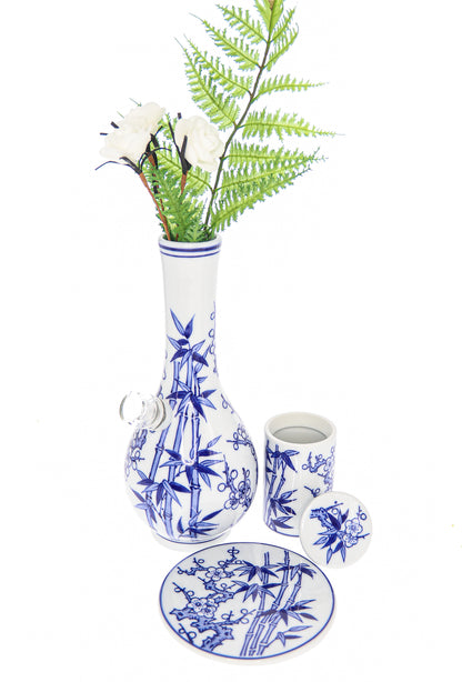 A front view of the “My Bud Vase “Luck” Porcelain Vase Bong”, displaying a white porcelain vase with delicate blue floral detailing.