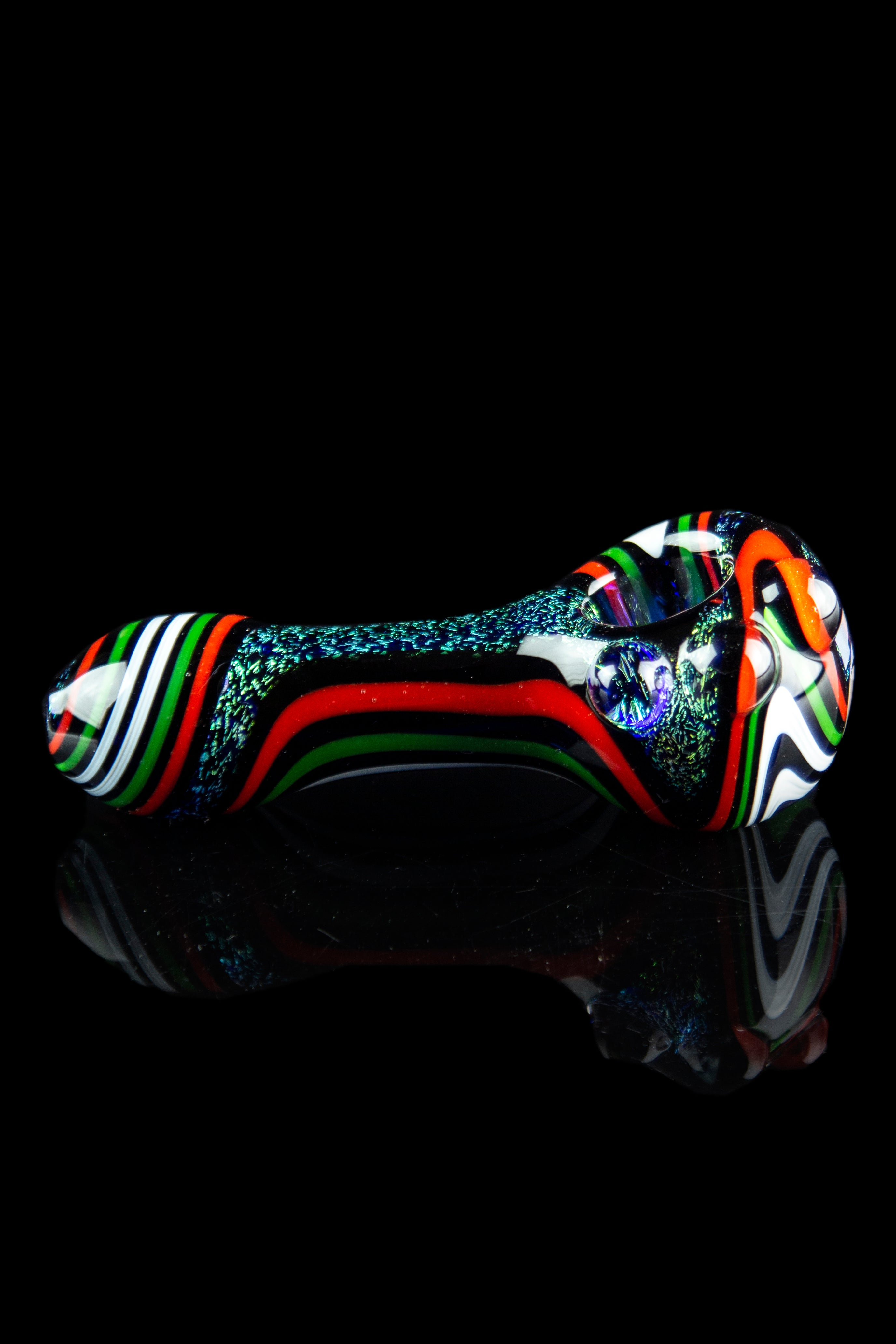 Colorful glass pipe with a reflective surface against a black background.