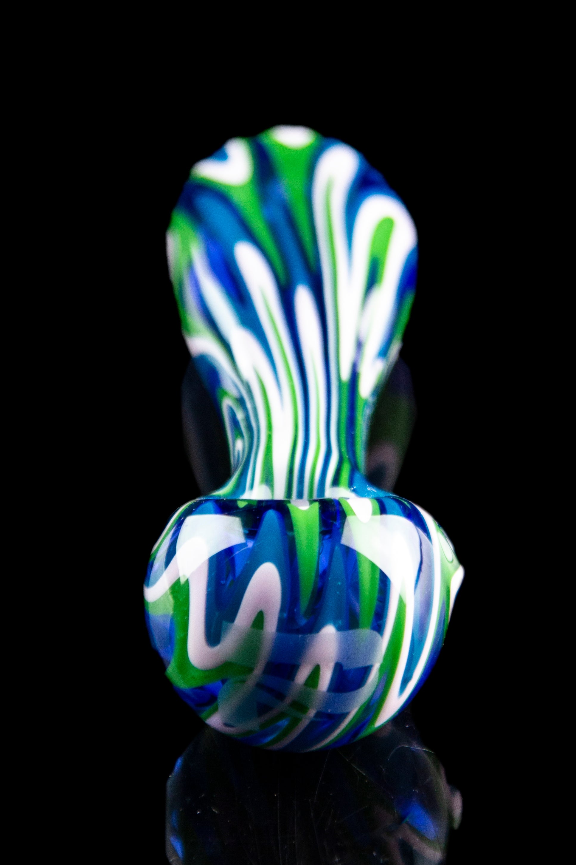 A vibrant glass pipe with swirling green, white, and blue patterns, displayed against a black background.